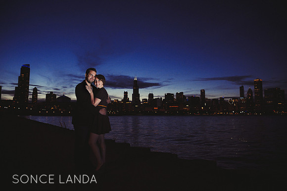 couple engaged on lakeshore