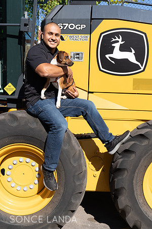 Evanston Waste management on construction equipment with rescue dog