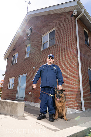 Coast Guard Auxiliarist with his rescue German Shepherd Dog