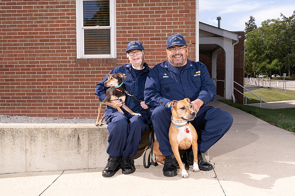 Coast Guard Auxiliarists with their rescue pets